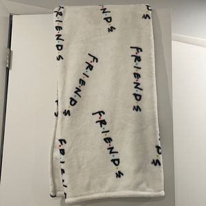 white “FRIENDS” throw blanket